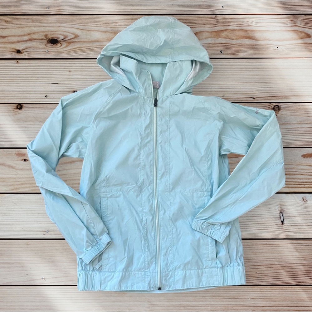 Columbia Light Blue light weight rain jacket, neck shield and zippered pockets